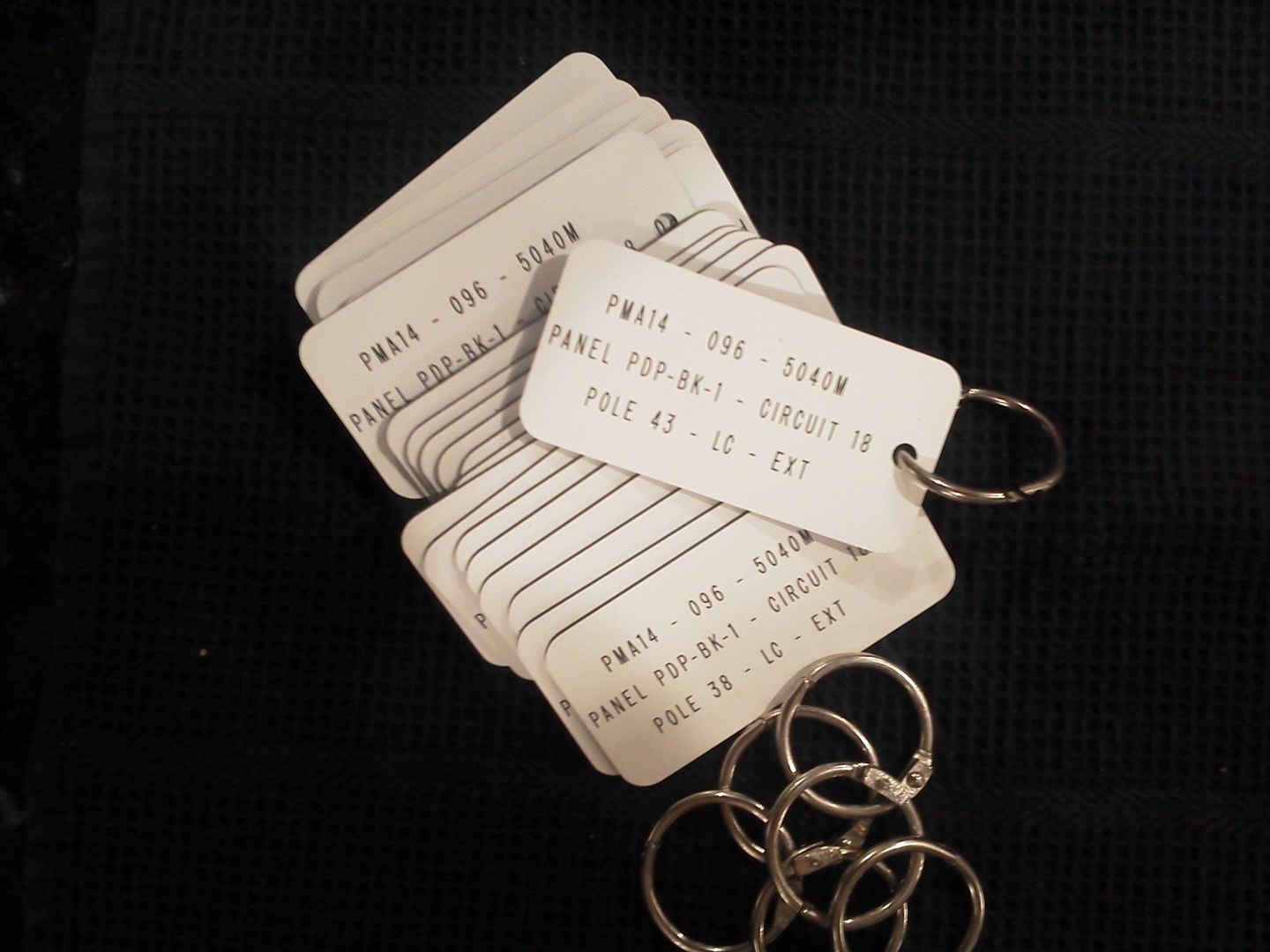 Engraved white plastic panel circuit ID keychains — PMA14-096-5040M series